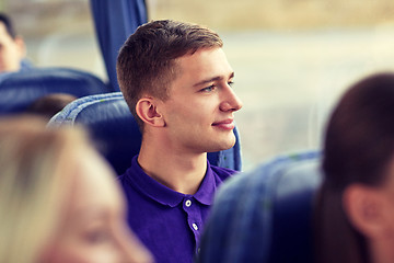 Image showing happy young man sitting in travel bus