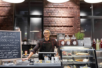 Image showing happy seller man or barman at cafe counter