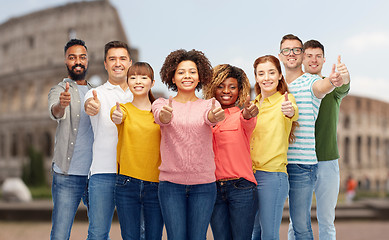 Image showing happy people showing thumbs up over coliseum