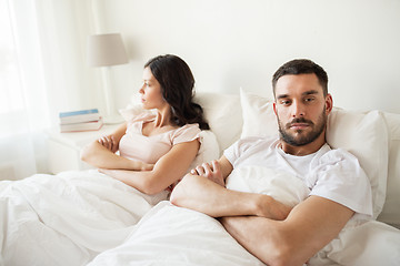 Image showing unhappy couple having conflict in bed at home