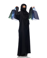 Image showing muslim woman in hijab with shopping bags