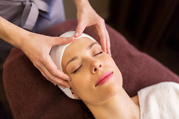 Image showing woman having face and head massage at spa