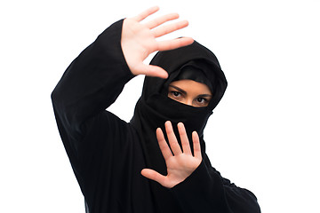 Image showing muslim woman in hijab showing stop sign