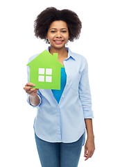 Image showing happy african american woman with green house icon