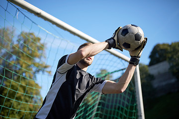 Image showing goalkeeper with ball at football goal on field