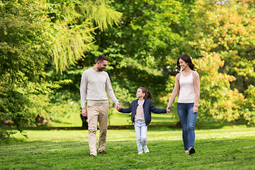 Image showing happy family walking in summer park