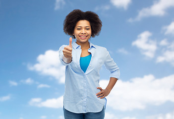 Image showing happy african american woman showing thumbs up