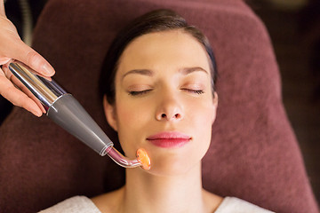 Image showing woman having hydradermie facial treatment in spa