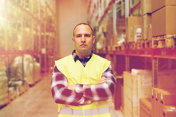 Image showing man in reflective safety vest at warehouse