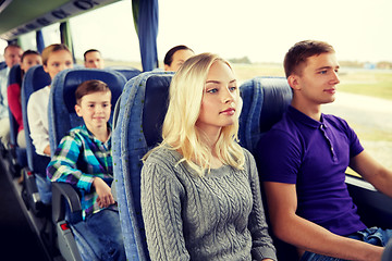 Image showing happy couple or passengers in travel bus