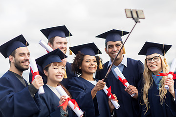 Image showing students or bachelors taking selfie by smartphone