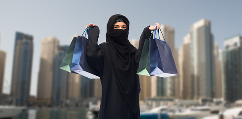 Image showing muslim woman in hijab with shopping bags in dubai