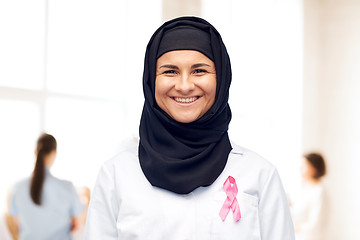 Image showing muslim doctor with breast cancer awareness ribbon