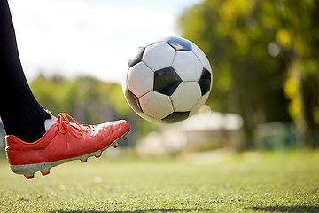 Image showing soccer player playing with ball on football field