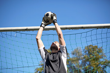 Image showing goalkeeper with ball at football goal on field