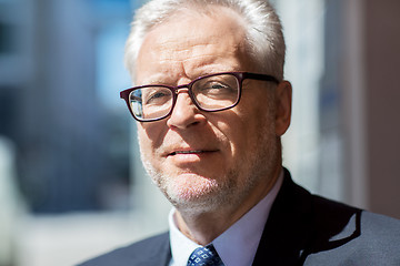 Image showing close up of senior businessman in eyeglasses