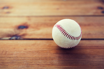 Image showing close up of baseball ball on wooden floor