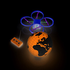 Image showing Quadrocopter Drone with Earth Globe and remote controller on a w