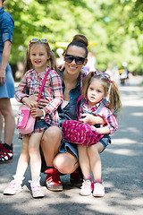 Image showing mother with her daughters in the park