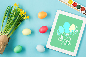 Image showing The top view of easter on blue table office workplace