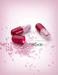 Image showing Pink capsules and pills background