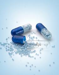 Image showing Blue capsules and pills background