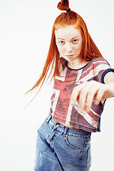 Image showing young pretty red head teenage hipster girl posing emotional happy smiling on white background, lifestyle people concept 