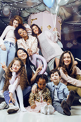 Image showing Lifestyle and people concept: young pretty diversity nations woman with different age children celebrating on birth day party together happy smiling, making selfie. African-american, asian and caucasi