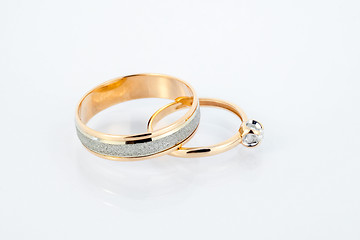 Image showing Gold wedding rings on white