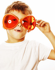 Image showing little cute boy in orange sunglasses pointing isolated close up 