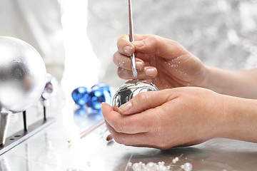 Image showing Christmas decorations. A self painted Christmas balls