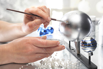 Image showing Painting Christmas balls. Manufacturing and crafts