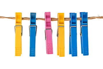 Image showing Multicolored plastic clothespins on a rope