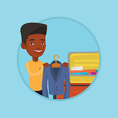 Image showing Young man packing his suitcase vector illustration