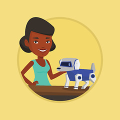 Image showing Happy young woman playing with robotic dog.