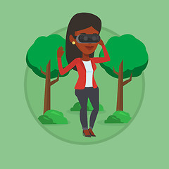 Image showing Woman wearing virtual reality headset in the park.