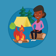 Image showing Woman sitting on log near campfire in the camping.