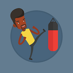 Image showing Man exercising with punching bag.