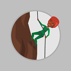 Image showing Woman climbing in mountains with rope.