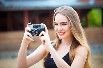 Image showing Young traveling woman in country