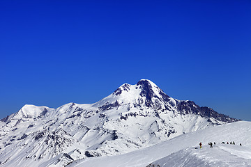 Image showing Off-piste slope and mount Kazbek at sun winter day