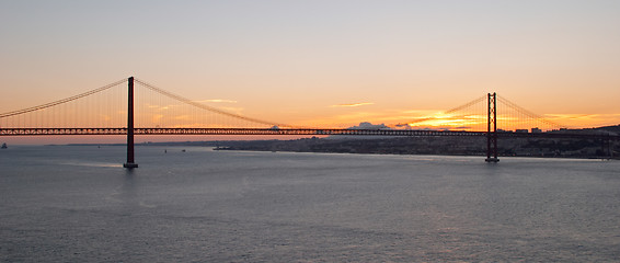 Image showing Bridge 25 de Abril on river Tagus at sunset, Lisbon, Portugal