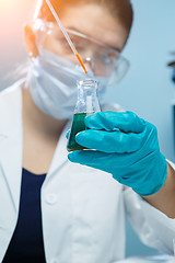 Image showing Woman in mask at lab
