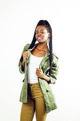 Image showing young pretty african-american girl posing cheerful emotional on white background isolated, lifestyle people concept