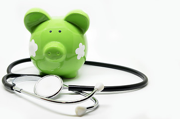 Image showing Piggy bank and stethoscope