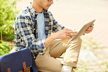 Image showing man with tablet pc and coffee on city street bench