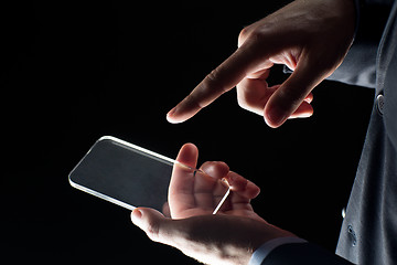 Image showing close up of businessman with glass smartphone