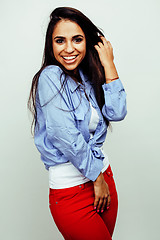 Image showing young happy smiling latin american teenage girl emotional posing on white background, lifestyle people concept 