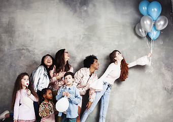 Image showing Lifestyle and people concept: young pretty diversity nations woman with different age children celebrating on birth day party together happy smiling, making selfie. African-american, asian and caucasi