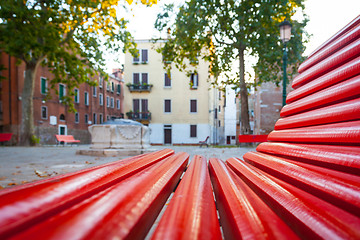 Image showing Venice from a red bench